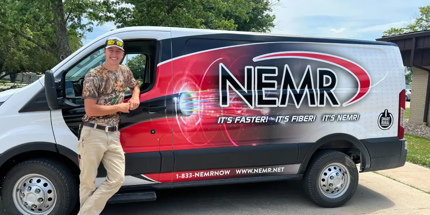 Person standing next to NEMR van. Person standing next to NEMR van.
